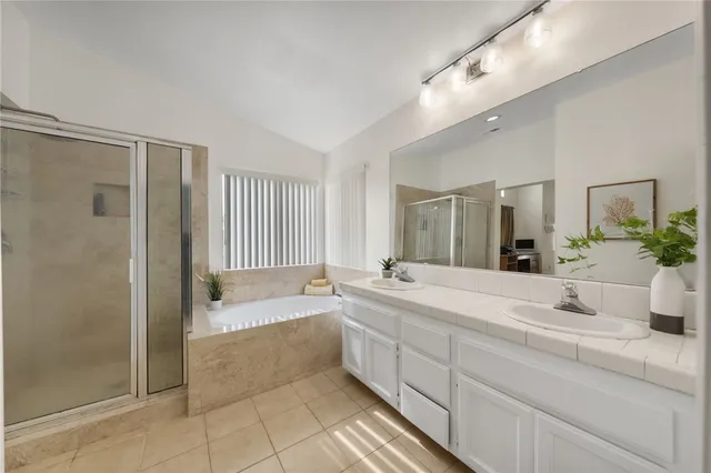 a view of a back yard with flower plants