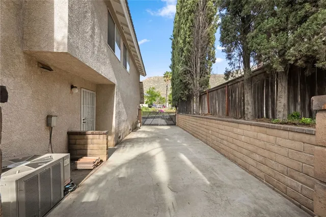a view of backyard with sitting area