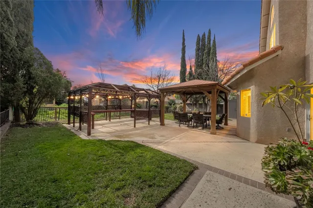 a view of a park with plants and a bench
