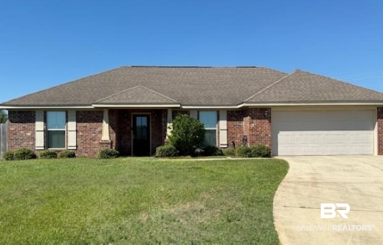 15577 Talus Court Foley, AL 36535 - Photo 1 of 28 Ranch-style house featuring a front yard, brick siding, an attached garage, and concrete driveway