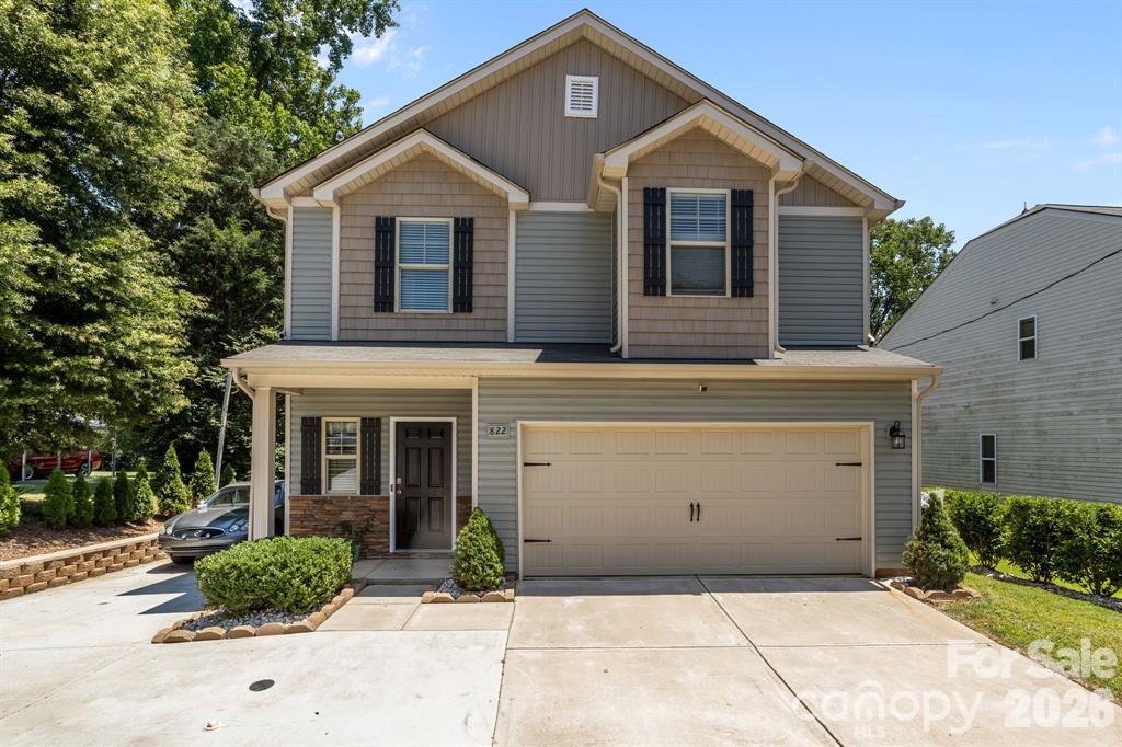 822 Lakehill Road Charlotte, NC 28214 - Photo 1 of 31 a front view of a house with garden