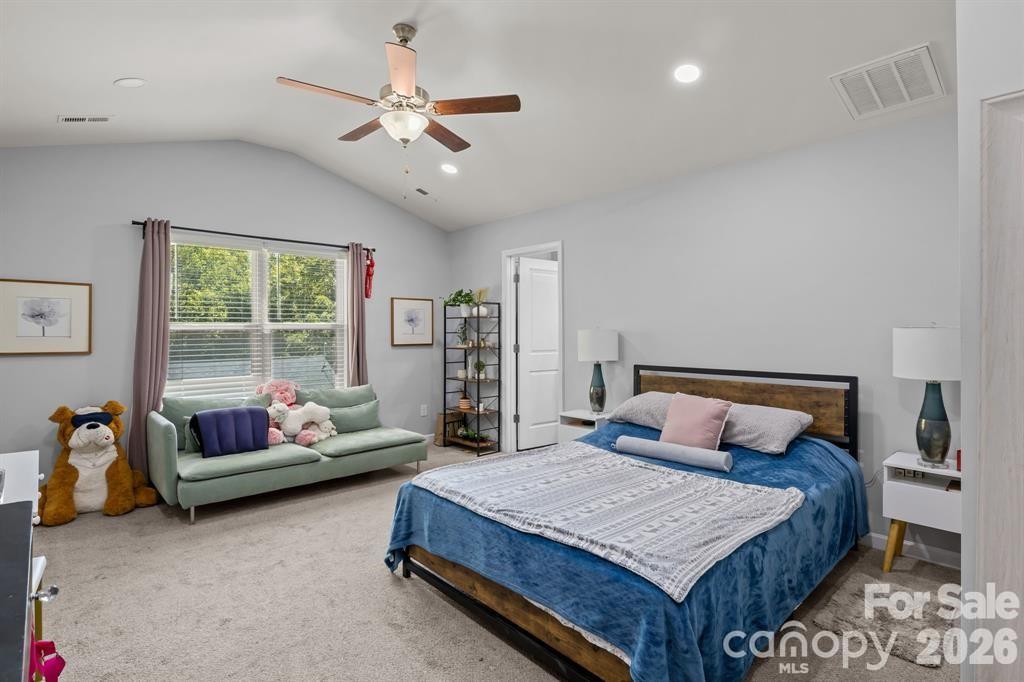 822 Lakehill Road Charlotte, NC 28214 - Photo 12 of 31 a bedroom with a bed and a couch