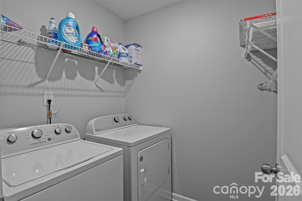 822 Lakehill Road Charlotte, NC 28214 - Photo 18 of 31 a utility room with dryer and washer
