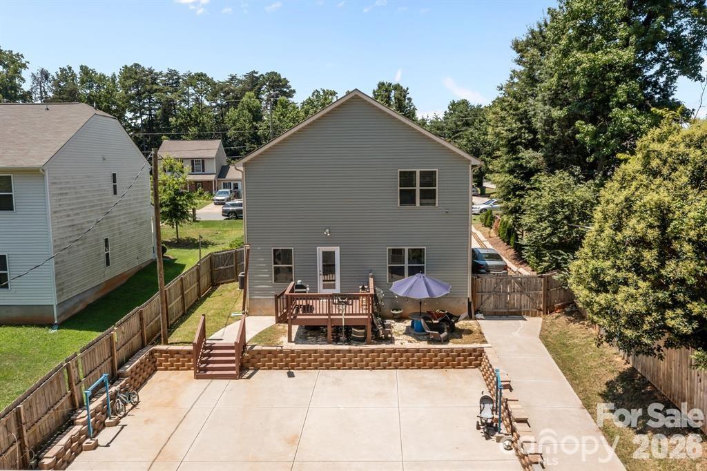 822 Lakehill Road Charlotte, NC 28214 - Photo 28 of 31 a view of a house with a patio