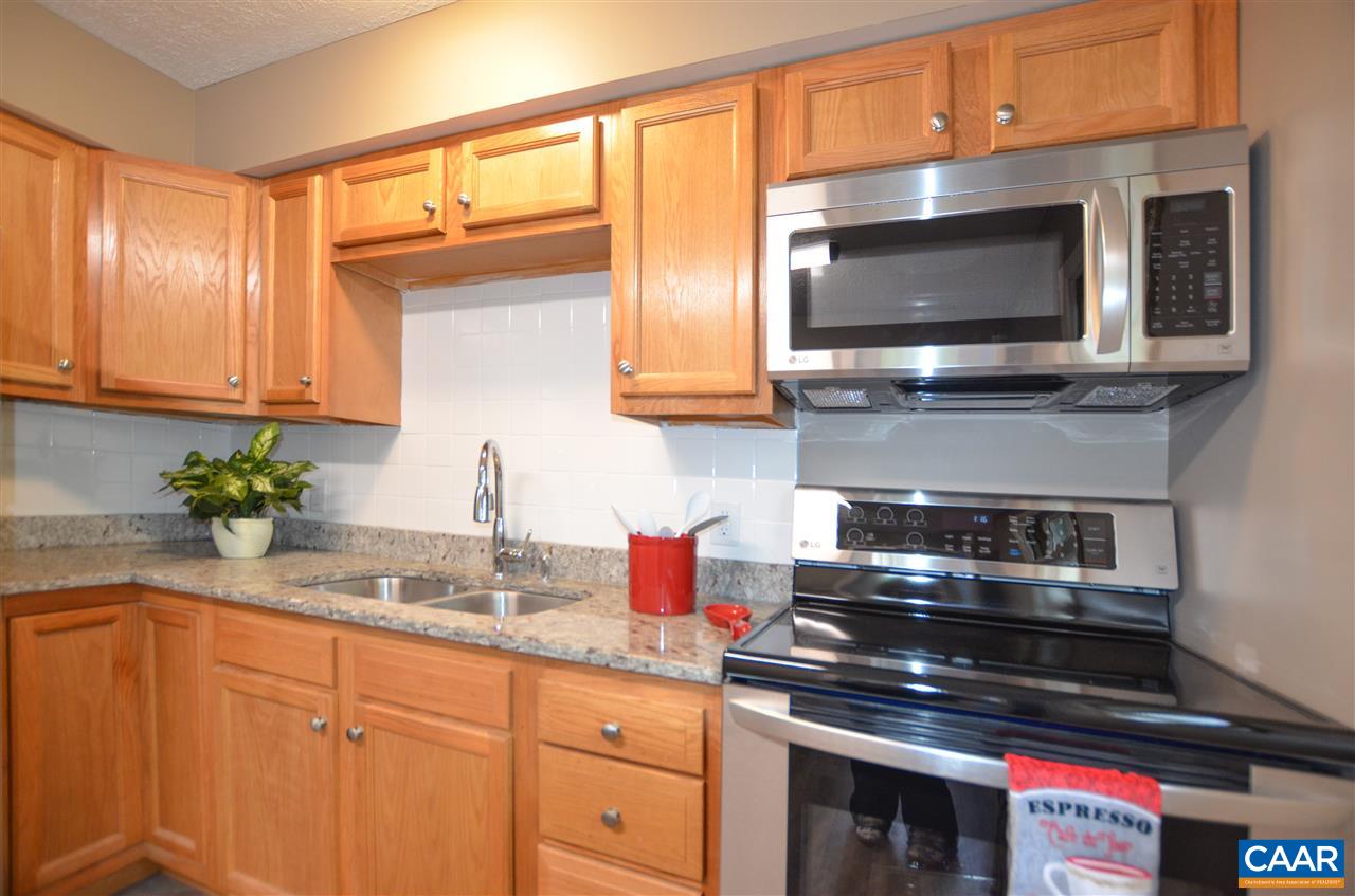 136 Bybees Church Road Palmyra, VA 22963 - Photo 13 of 43 a kitchen with stainless steel appliances granite countertop a stove and a microwave