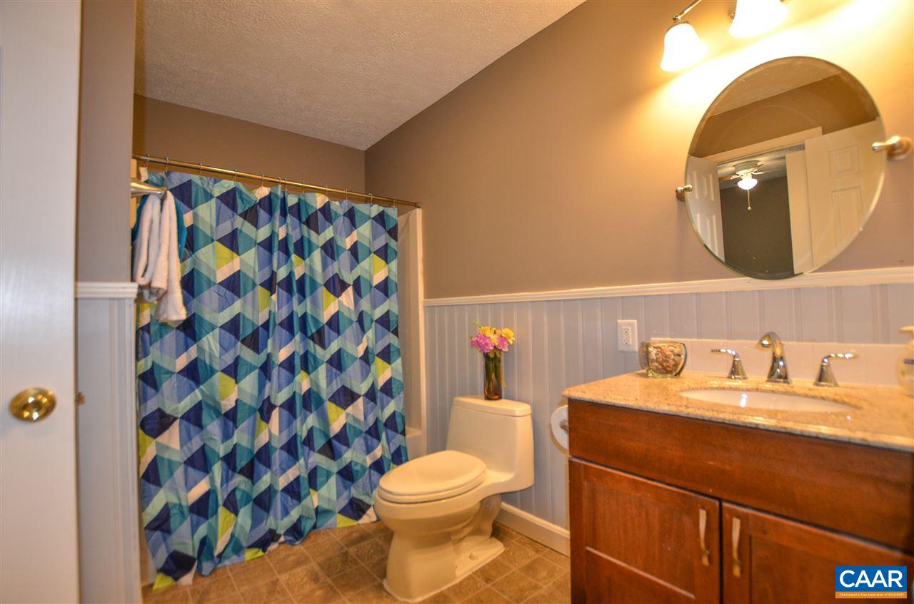 136 Bybees Church Road Palmyra, VA 22963 - Photo 17 of 43 a bathroom with a sink toilet and shower