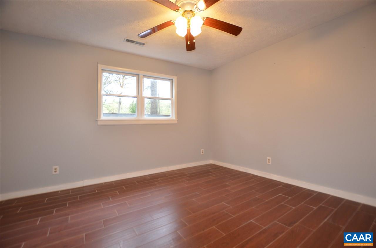 136 Bybees Church Road Palmyra, VA 22963 - Photo 30 of 43 wooden floor in an empty room with a window