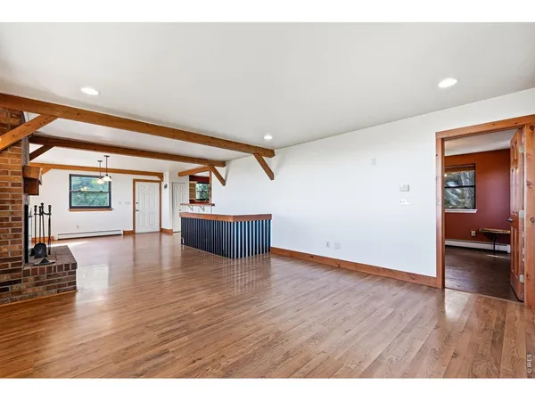 a view of a living room and kitchen