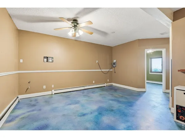 a view of a room with window and wooden floor