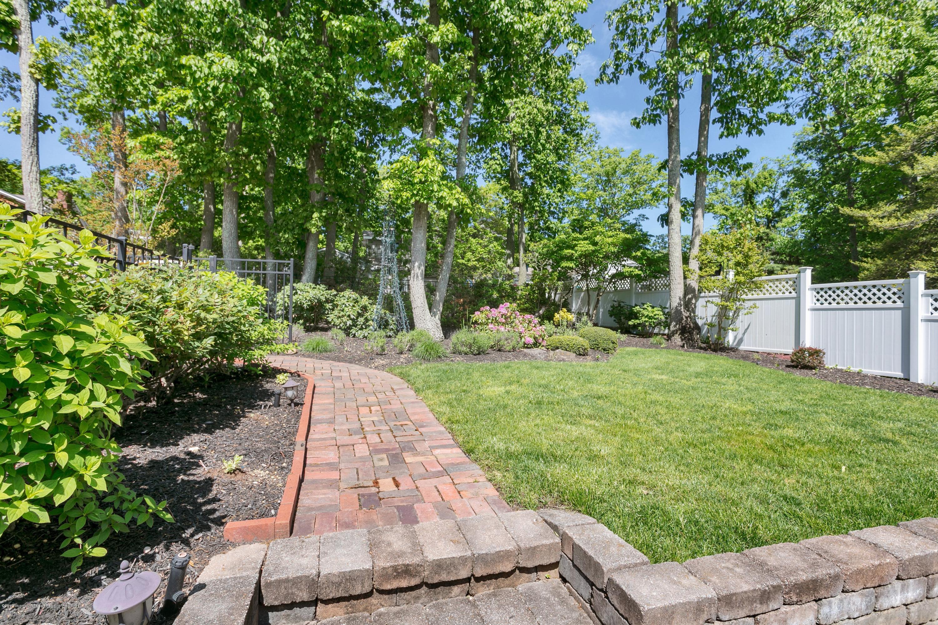 642 Valley Road Brielle, NJ 08730 - Photo 30 of 40 Backyard walkway to fenced in pool