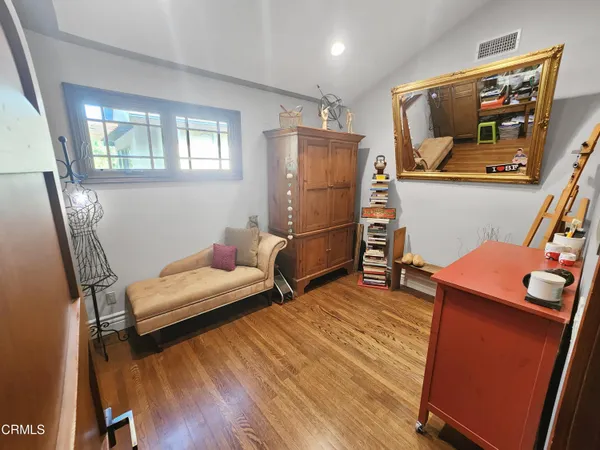 a room with gym equipment and a flat screen tv