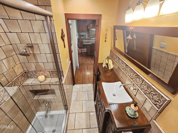 a view of a patio with couches and potted plants