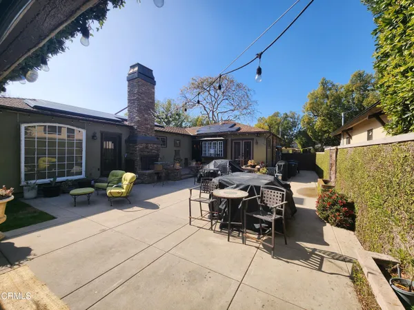 a view of yard with swimming pool and green space