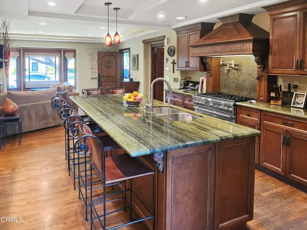 a kitchen with stainless steel appliances a refrigerator and cabinets