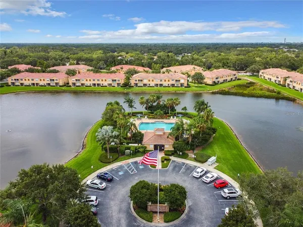 an aerial view of a houses with a lake view