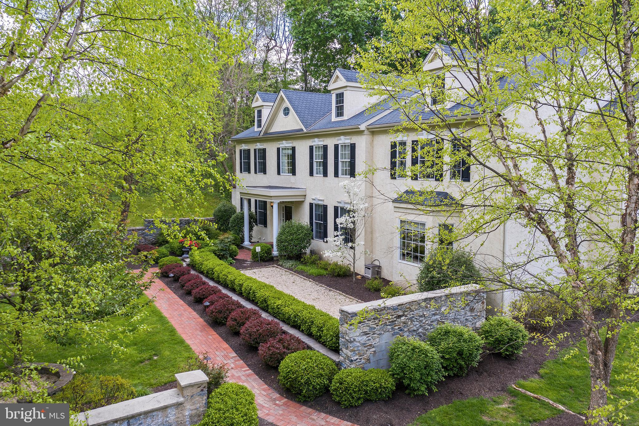 718 North Valley Road Paoli, PA 19301 - Photo 2 of 44 Stone wall courtyard entrance