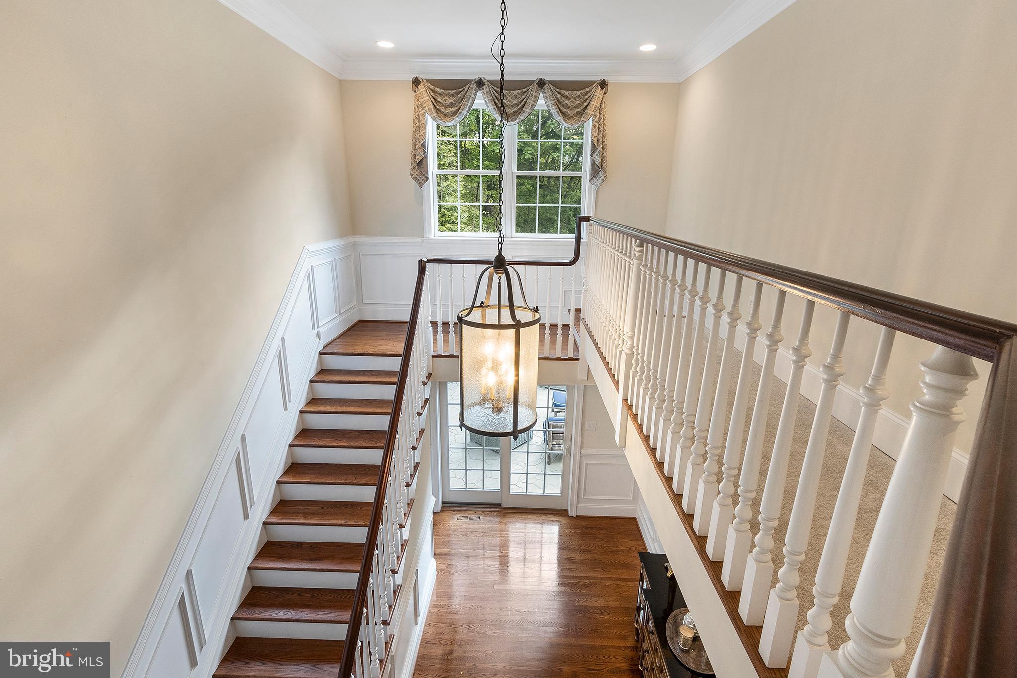 718 North Valley Road Paoli, PA 19301 - Photo 17 of 44 Hardwood staircase with wainscoting