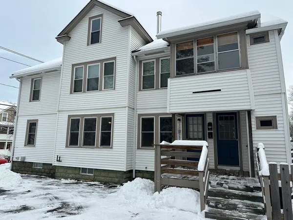 a front view of a house with glass windows
