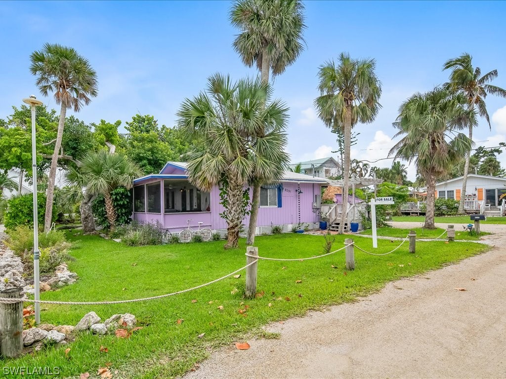 a view of a house with a backyard