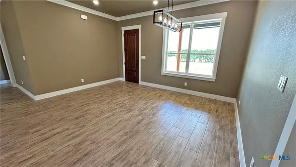 a view of livingroom with hardwood floor and window