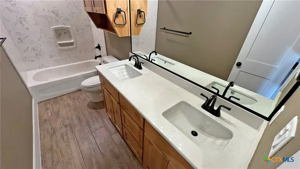 a bathroom with a sink and mirror