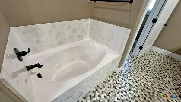 a bathroom with a bathtub
