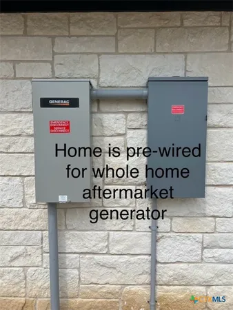 a view of a house with a yard and fence