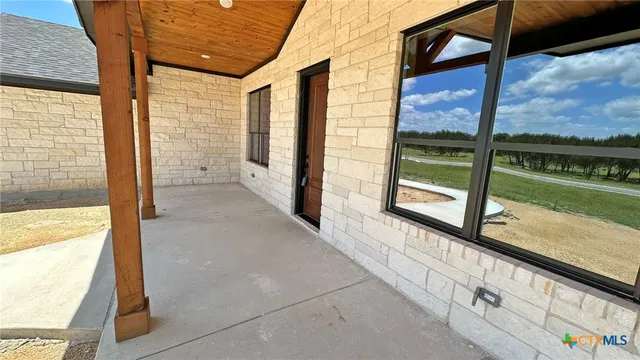 a kitchen with stainless steel appliances a stove a microwave a sink and a refrigerator