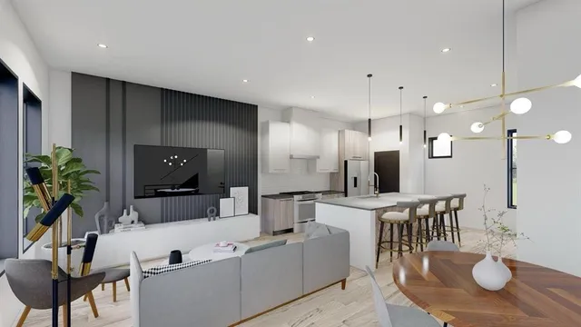 a large kitchen with a table and chairs