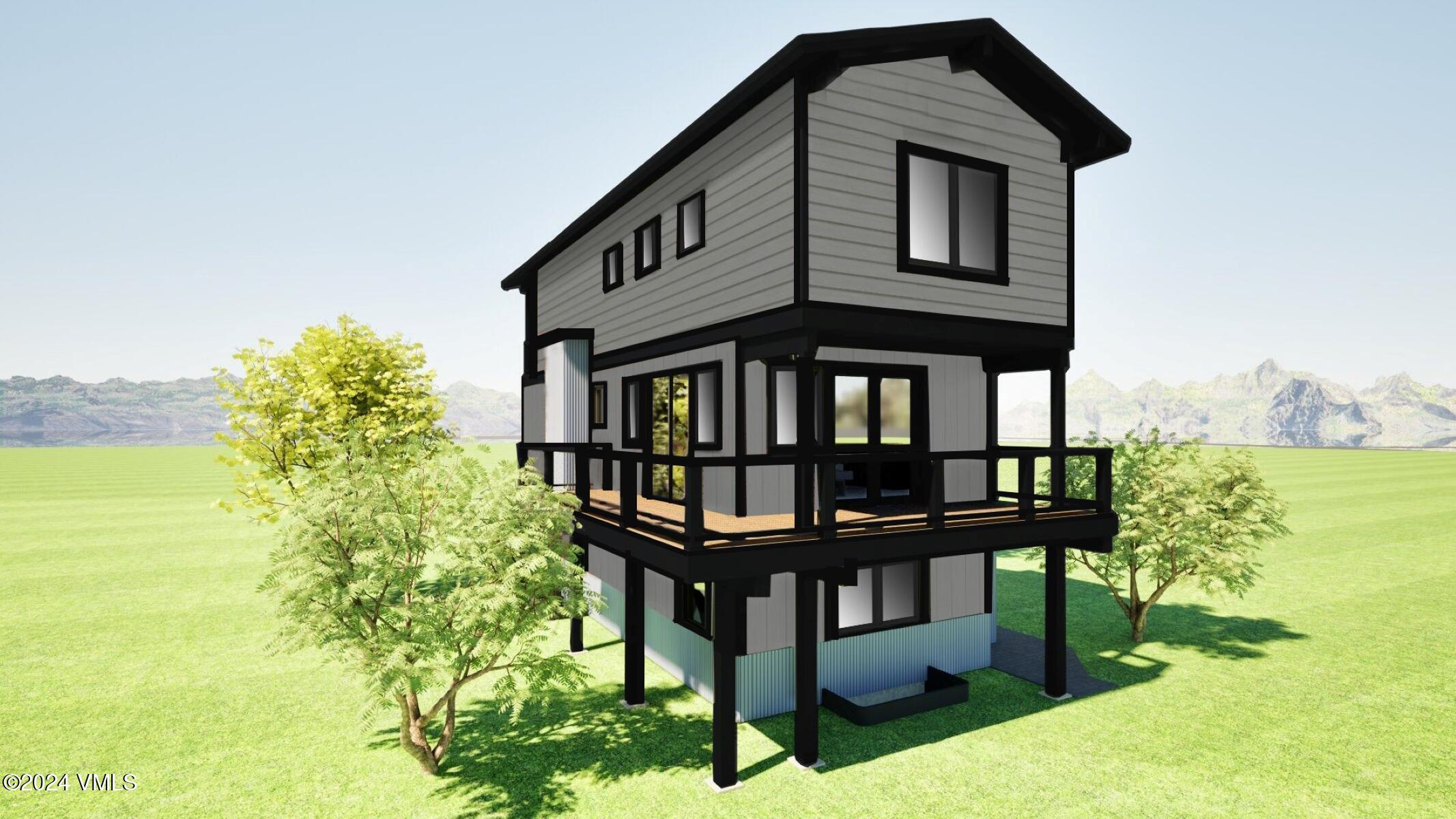 15 Belden Way Minturn, CO 81645 - Photo 3 of 5 a front view of a house with a yard wooden fence and a tree