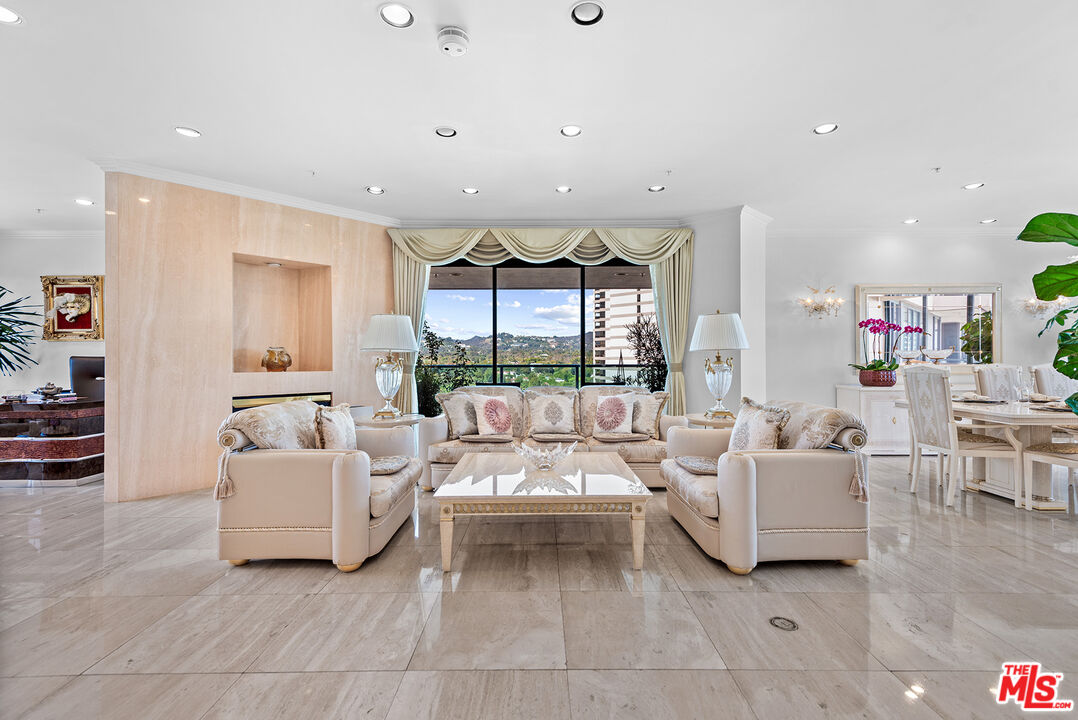 10490 Wilshire Boulevard, Unit 1206 Los Angeles, CA 90024 - Photo 1 of 44 a living room with furniture and a large window