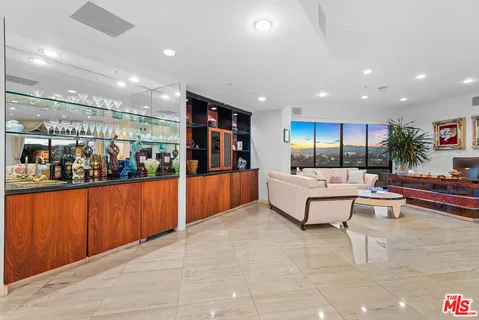 a dining room with furniture a livingroom and chandelier