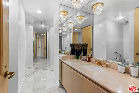 a bedroom with a bed and a lamp