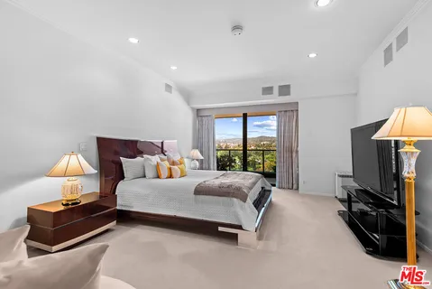 a view of storage and utility room with washer and dryer