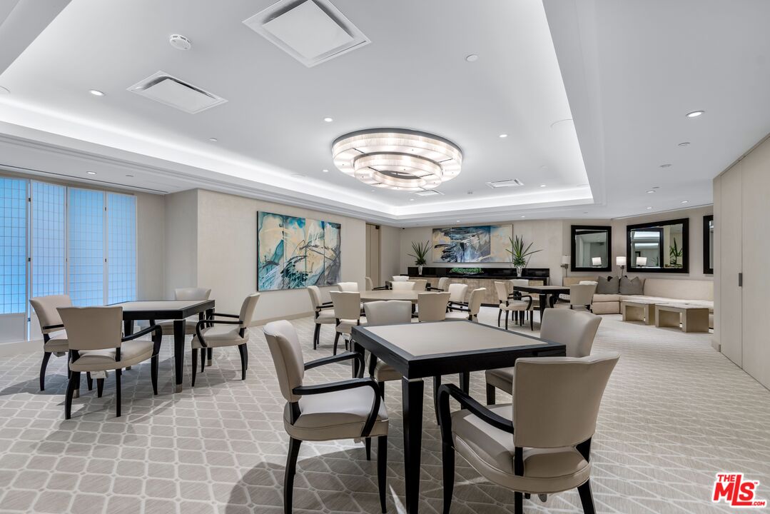 10490 Wilshire Boulevard, Unit 1206 Los Angeles, CA 90024 - Photo 41 of 44 a view of a dining room with furniture and wooden floor
