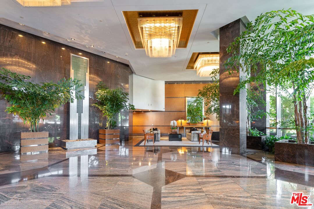 10490 Wilshire Boulevard, Unit 1206 Los Angeles, CA 90024 - Photo 42 of 44 a view of a patio with couches table and chairs and potted plants