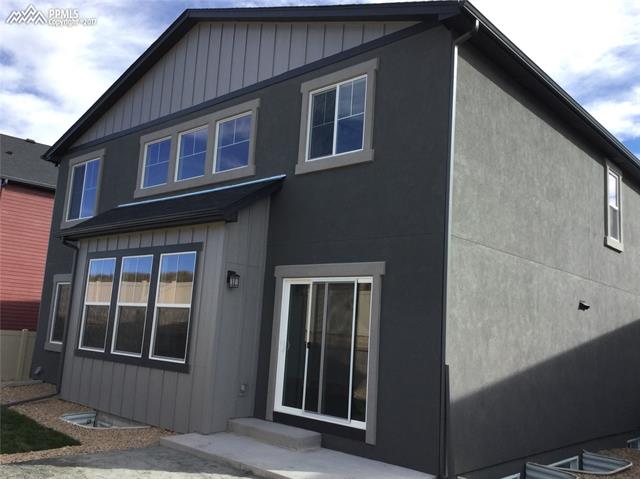 8764 Vanderwood Road Colorado Springs, CO 80908 - Photo 3 of 4 Exterior Rear with plenty of windows providing plenty of natural Colorado light!