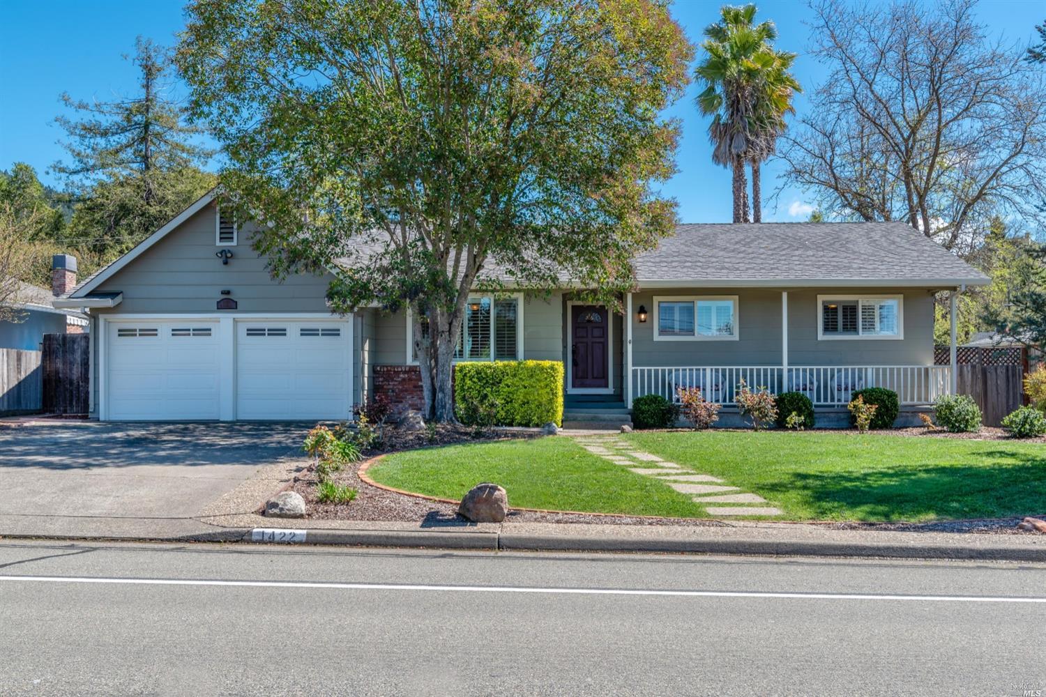 1422 St Francis Road Santa Rosa, CA 95409 - Photo 1 of 1 a front view of a house with a garden and trees
