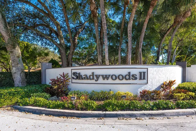 a outdoor space with lots of trees and plants