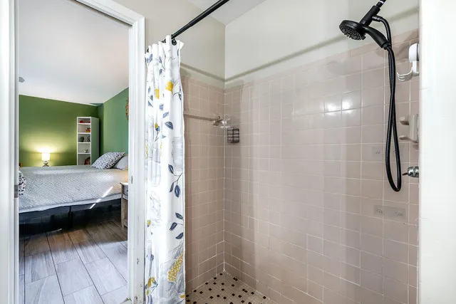 a bathroom that has a glass shower door