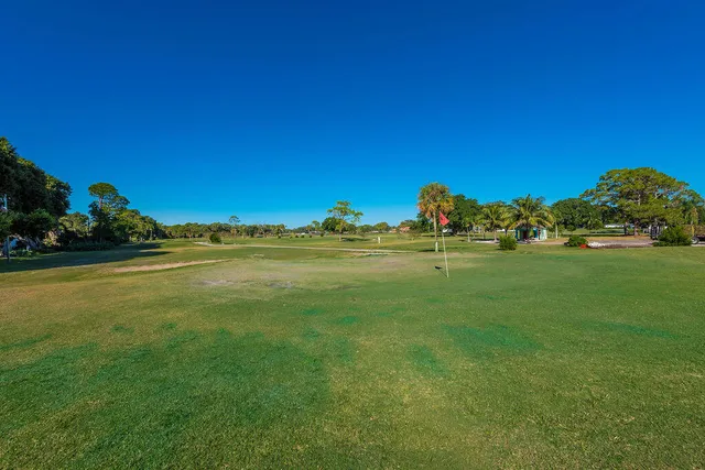 a view of a golf course with a lake