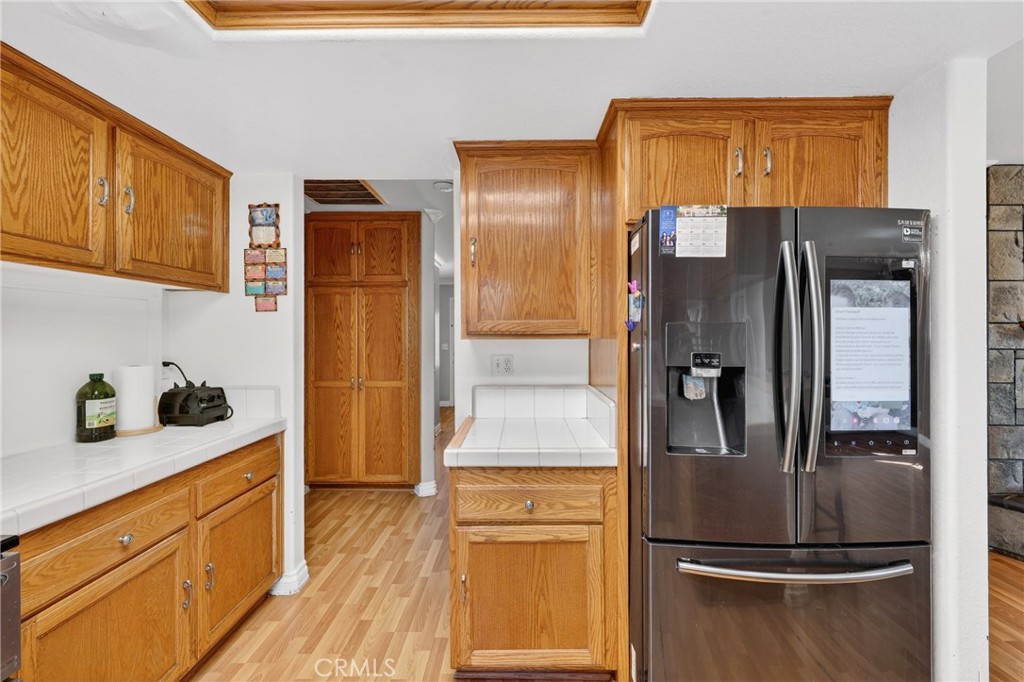 10939 Little Lake Road Downey, CA 90241 - Photo 12 of 55 a kitchen with stainless steel appliances granite countertop a refrigerator and a cabinets