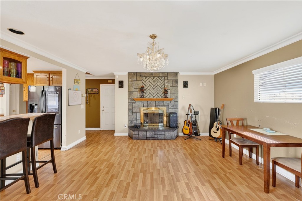 10939 Little Lake Road Downey, CA 90241 - Photo 16 of 55 a living room with furniture and a wooden floor