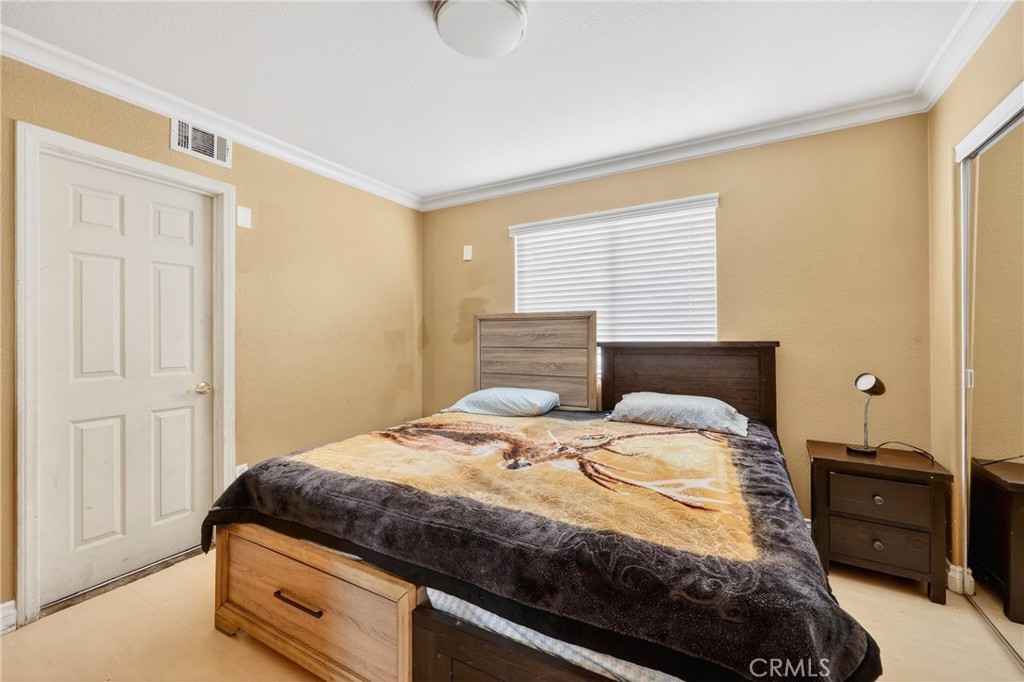 10939 Little Lake Road Downey, CA 90241 - Photo 19 of 55 a bedroom with a bed and a closet