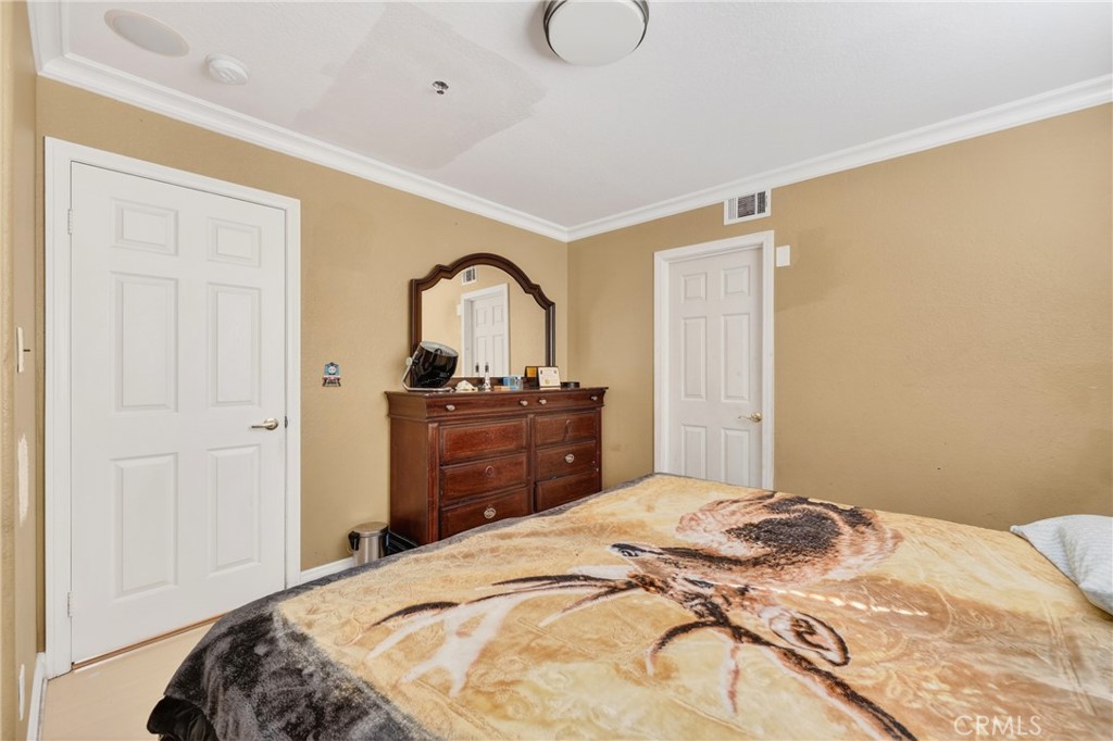 10939 Little Lake Road Downey, CA 90241 - Photo 20 of 55 a bedroom with a bed and a dresser