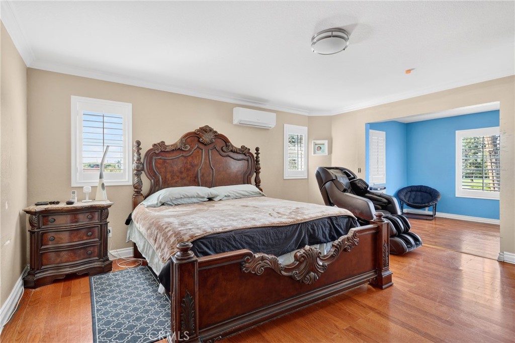 10939 Little Lake Road Downey, CA 90241 - Photo 27 of 55 a bed room with a bed and dresser