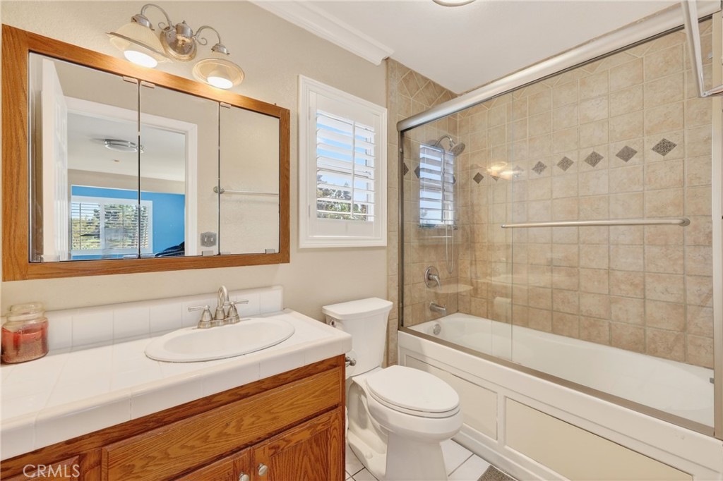 10939 Little Lake Road Downey, CA 90241 - Photo 30 of 55 a bathroom with a sink toilet and shower