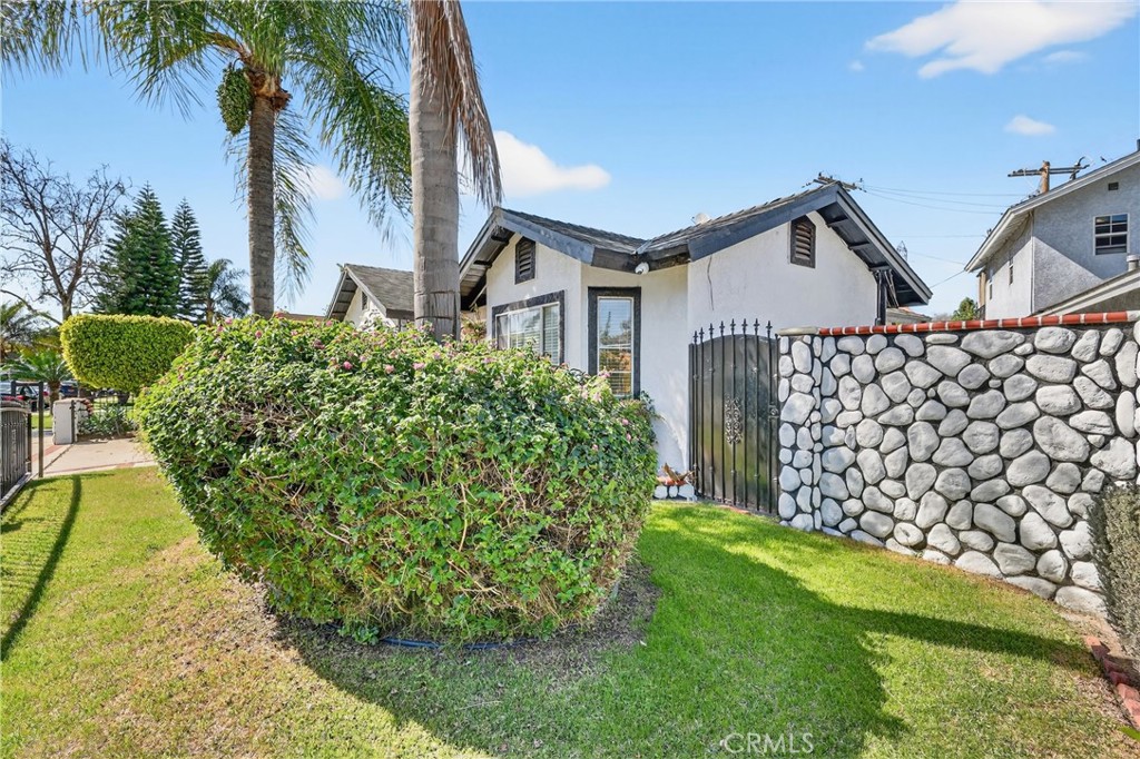 10939 Little Lake Road Downey, CA 90241 - Photo 40 of 55 a front view of a house with garden