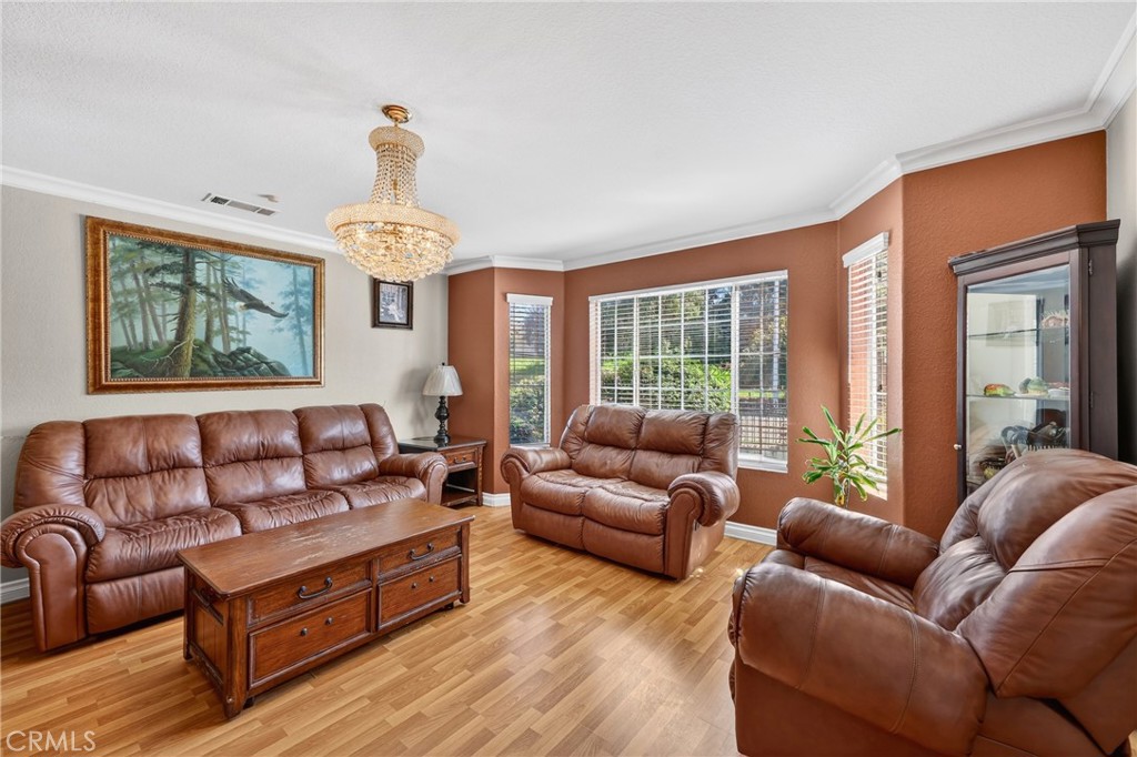 10939 Little Lake Road Downey, CA 90241 - Photo 6 of 55 a living room with furniture and a chandelier