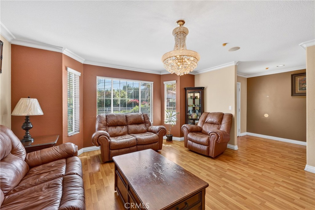 10939 Little Lake Road Downey, CA 90241 - Photo 7 of 55 a living room with furniture chandelier and a large window